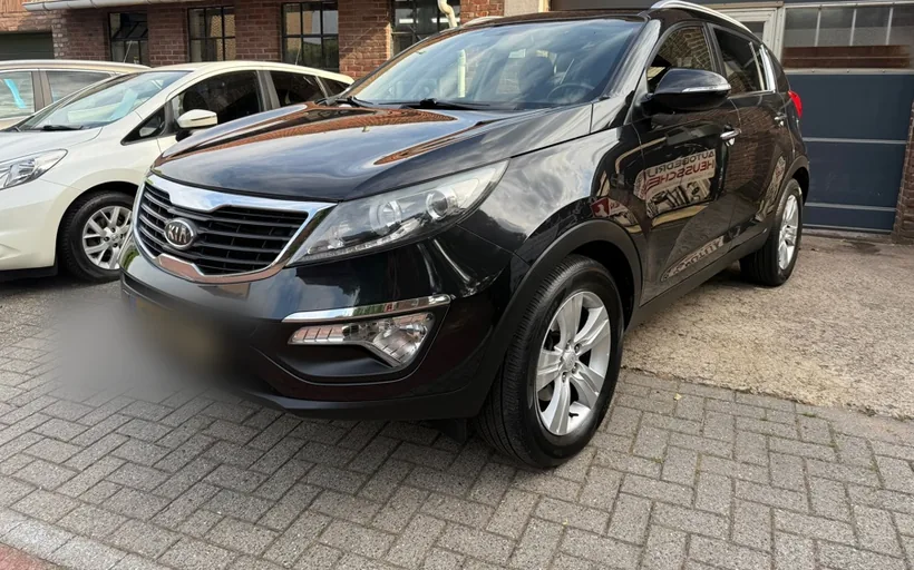 Kia Sportage uit 2012 op het terrein van Autobedrijf Heusschen